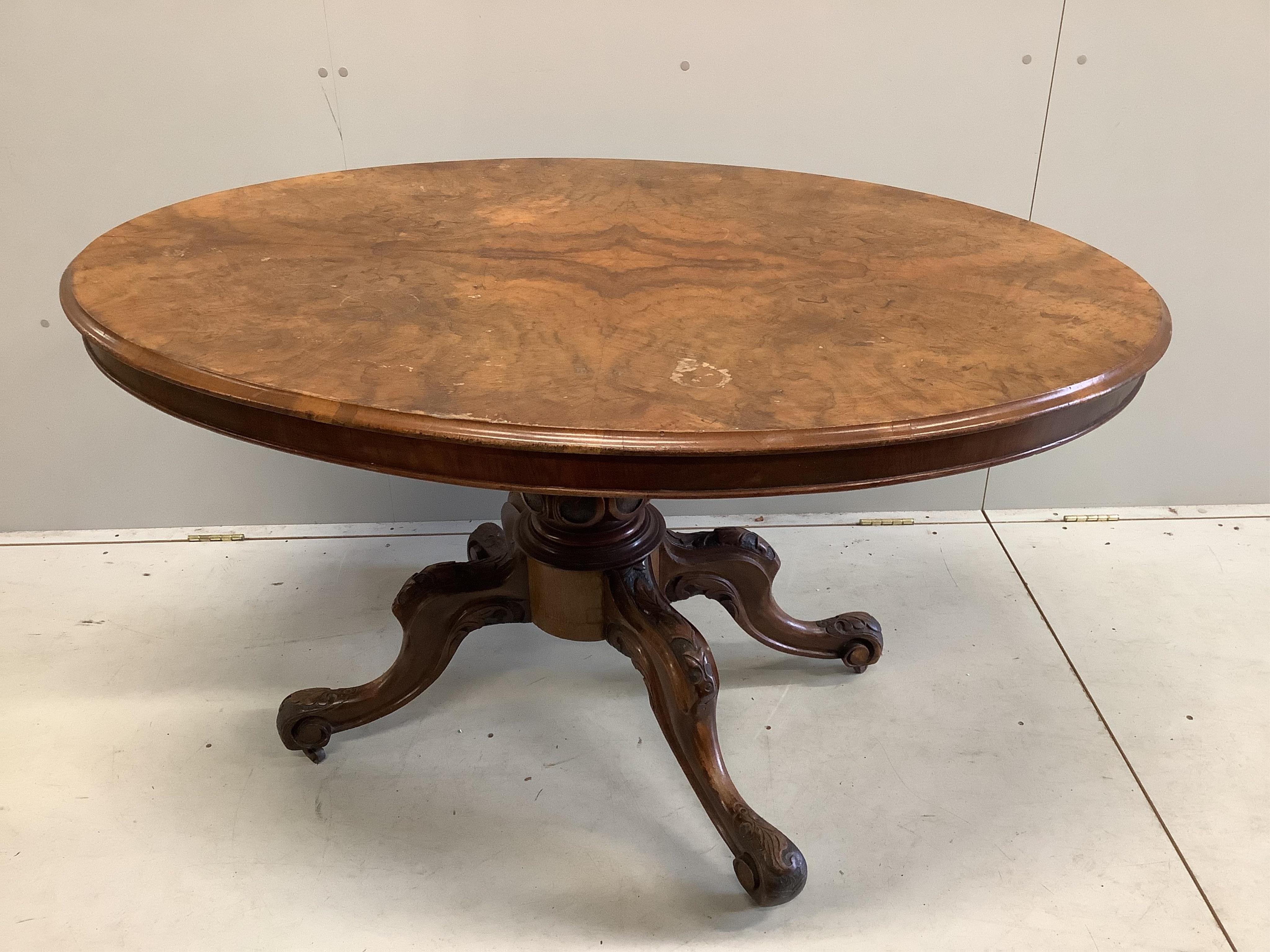 A Victorian oval burr walnut tilt top loo table, (missing one bolt), width 136cm, depth 98cm, height 72cm. Condition poor.